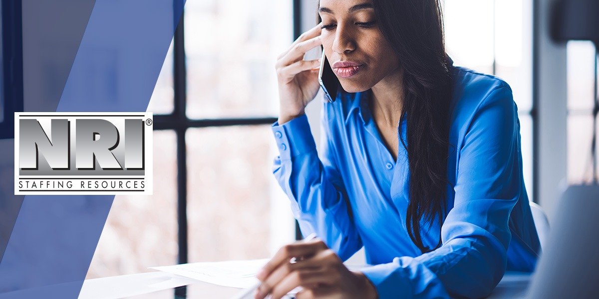 Female paralegal on a phone call with a client