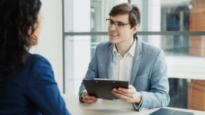 Hiring manager discussing why do you want to work here in a face-to-face job interview setting.
