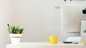 Administrative entry level jobs workspace setup with desktop computer, organized desk, office supplies, and modern administrative office environment.