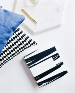 Administrative assistant organizing office tasks, planning materials, and scheduling at a professional workspace