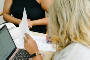 mployer reviewing candidate resume during hiring process, illustrating how to choose the right staffing agency for better hiring decisions
