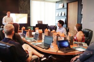 temp to hire employer presenting onboarding overview to a new team during a what is temp to hire trial period.