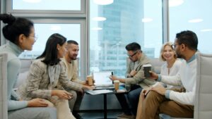 IT staff augmentation team of professionals collaborating on technology project in modern office