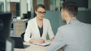 staffing agency recruiter helping a job seeker find work for free in 2026