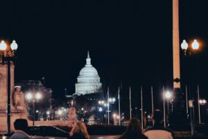 security clearance staffing DMV — US Capitol Building at night representing the federal government contracting market in Washington DC