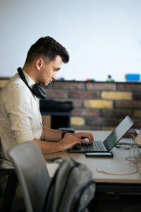 entry level jobs DMV — recent graduate searching for entry level opportunities in DC Maryland and Virginia on a laptop.