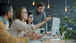 Hiring manager working with team to hire IT contractors for a project