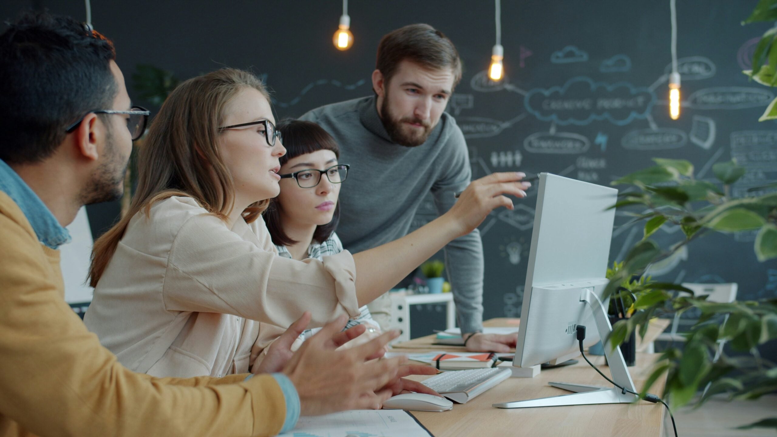 Hiring manager working with team to hire IT contractors for a project