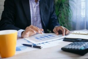 Reviewing financial charts and figures — accounting staffing in the DMV before year-end close.