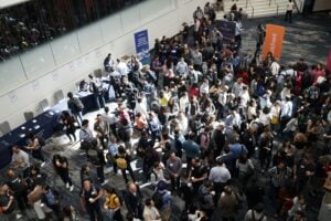 Attendees fill the floor at a large convention — the kind of event NRI helps staff on short notice.
