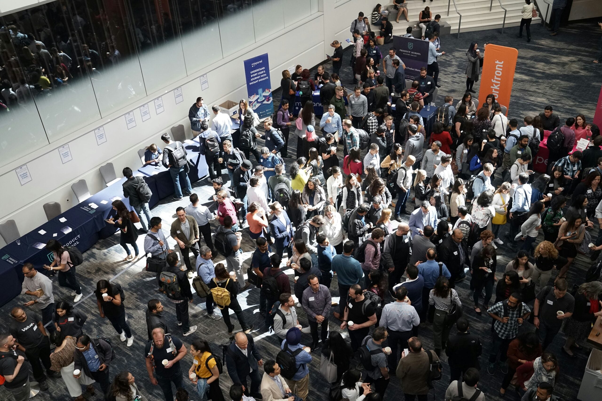 Attendees fill the floor at a large convention — the kind of event NRI helps staff on short notice.