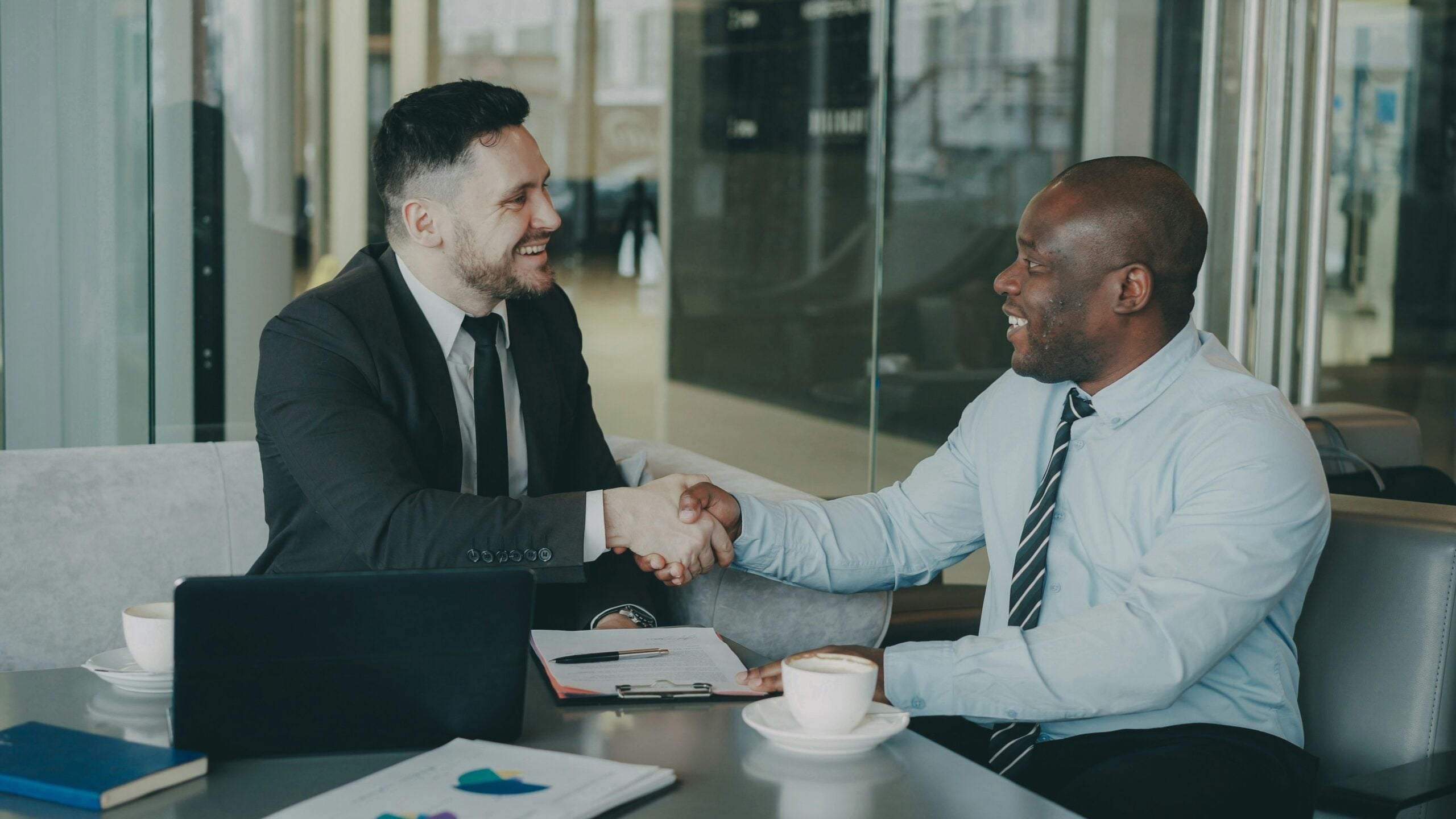 Salary negotiation for new grads — sealing a job offer with a handshake