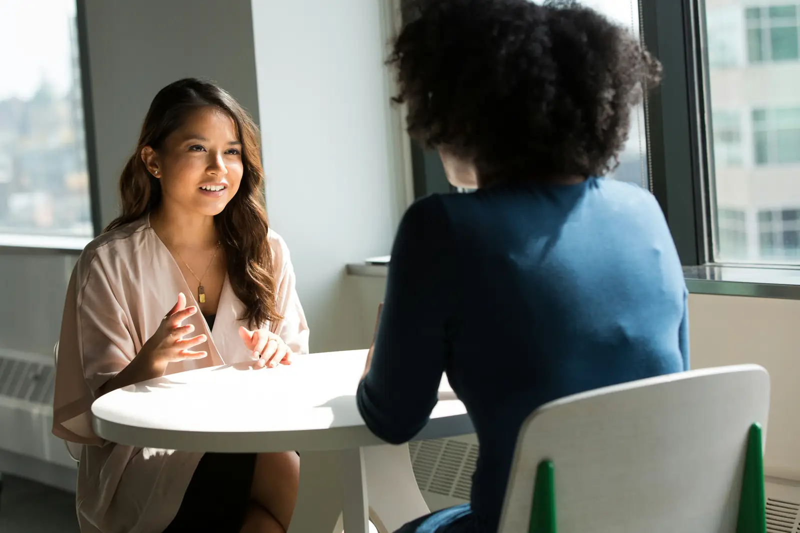 A candidate preparing questions to ask at the end of an interview.