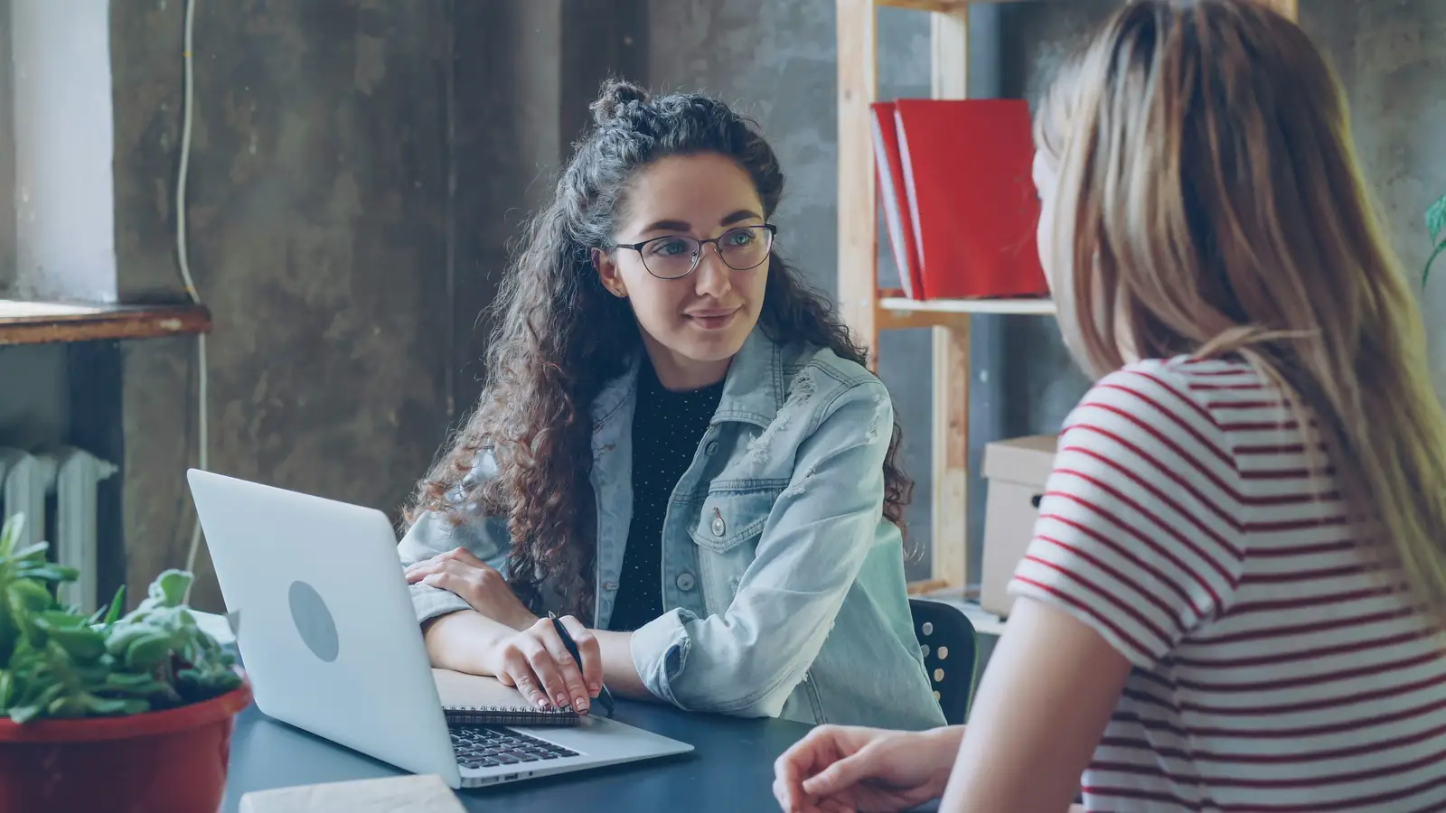 A candidate answering "tell me about yourself" in a job interview.